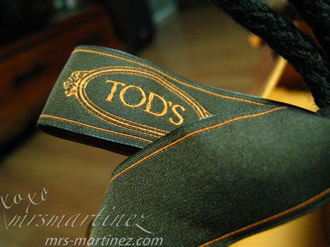 how to spot fake tod's bag|tods purse logo.